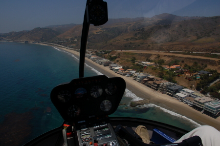 R44 Helicopter flying off Malibu