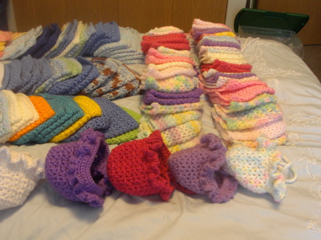 100 donated crocheted baby bonnets - 2009