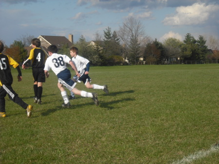 Aaron running after soccer ball