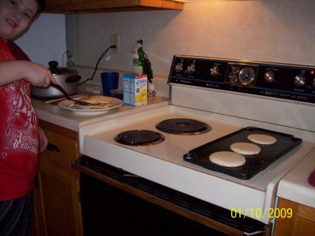 Dakota making me pancakes for the 1st time