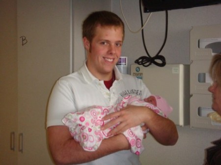 Our aon Robby, holding his new niece, Peyton