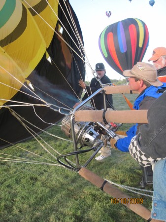 Pilot Mike Korfe fills balloon with hot air