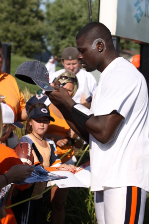 Alex Brown signing autographs after practice