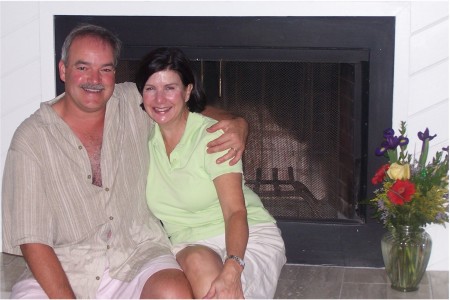 Paul & Becky on fireplace in Kiawah