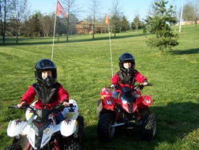 grandsons on 4 wheelers at age 5