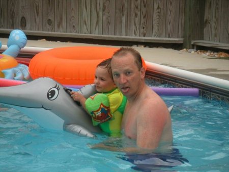 me and my boy riding a dolphin