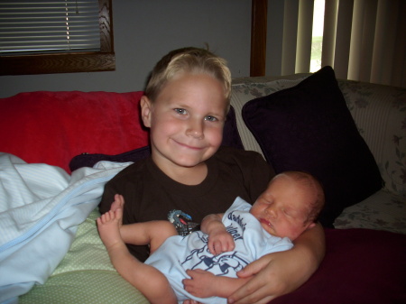 DJ holding his new baby brother Ben