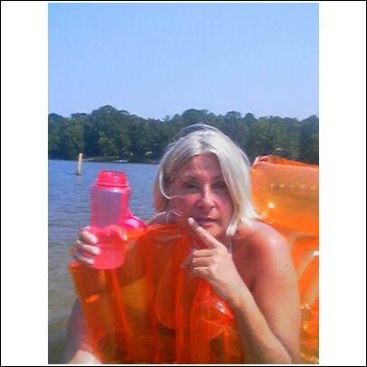 mom on raft at lake