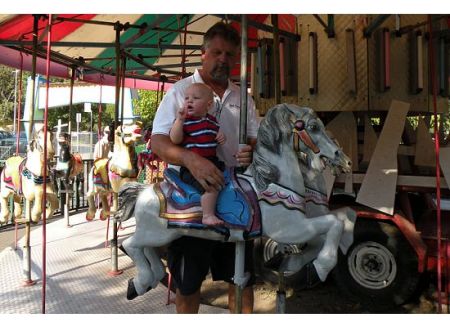 Riding carousel with Grandpa