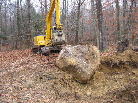 Bringing out the big toys to move a rock!