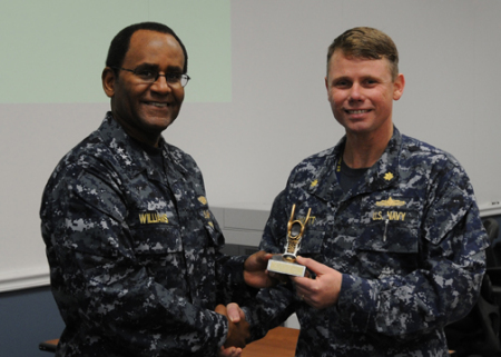 Accepting trophy from VADM Williams