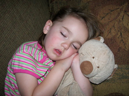 Grace naping with her bear Deetee.