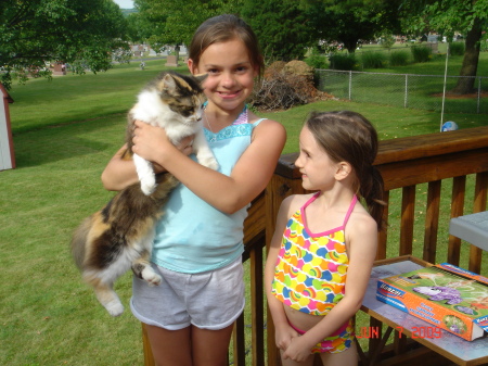 Haley (11) and Caitlyn (7) with Cali, our cat