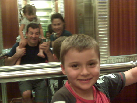 Ashton with family in mirror