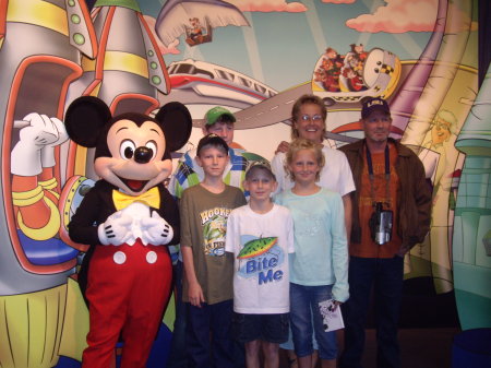 Family picture with Mickey at Disney