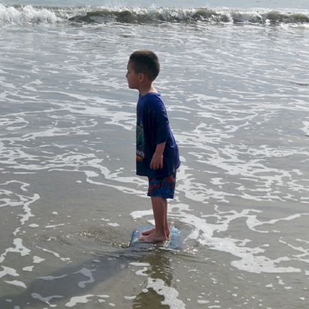 Grandson Anthony Jr learns to surf
