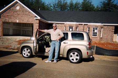 In front of new home with "Babe Magnet"rental