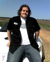 Son Sitting on hood of his first car