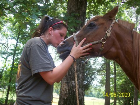 Carley with the love of her life!! Horses