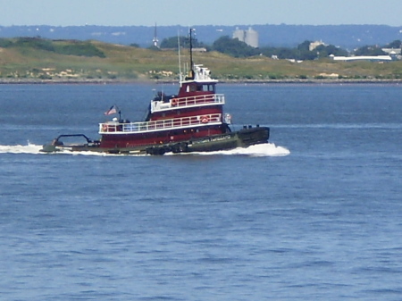 Tugboat alongside the ferry