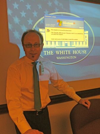 Dennis giving briefing at White House in 2009