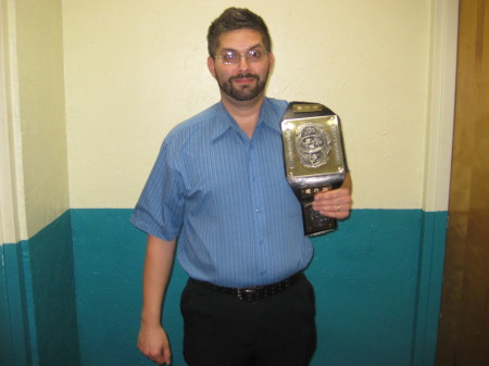 Holding GCW Heavyweight Belt