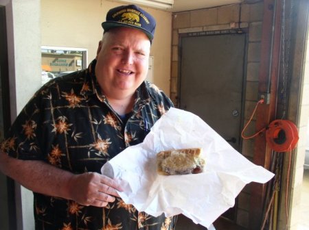 Charlie with a Sub Sandwich from his deli