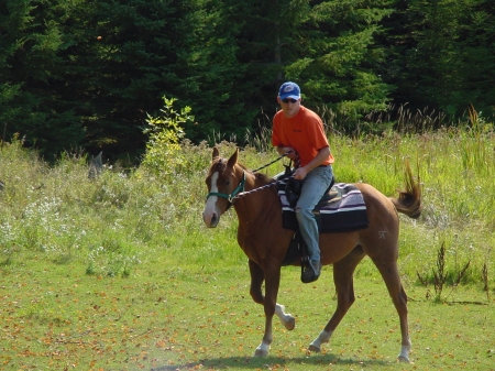 Youngest son Michael riding my horse Remi