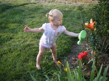 Zoe watering Mema's flowers