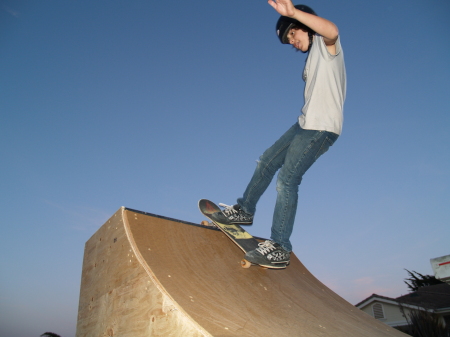 My son Shane skateboarding on his quarter pipe