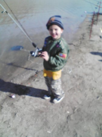 Cayden (age 4) fishing with grandpa.