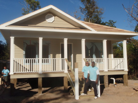 Dewayne and Kelly in front of their new home