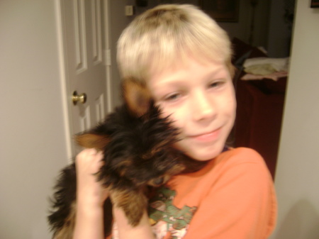 My grandson and pet yorkie