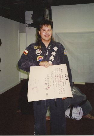 Tim getting Black Belt Certificate