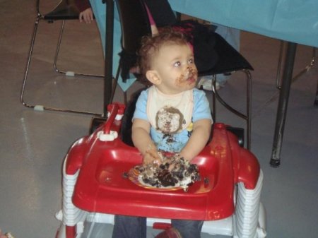 Izzy eating his first birthday cake.