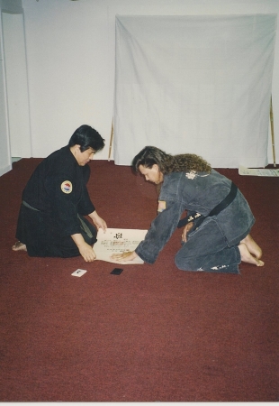 Getting hand stamped on BlackBelt Certificate