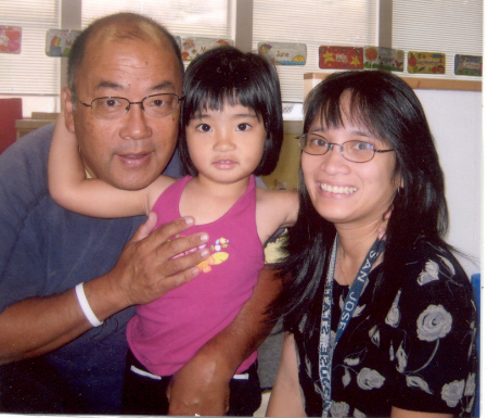 Dad, Retta, and Mom at school