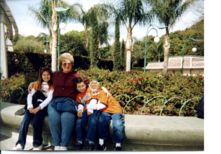 Pat & grandkids at Disneyland