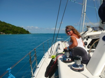 Me at the helm of Manu Kai in Huahine, Fr Poly