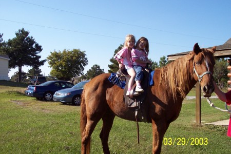 Ali and Brie riding Jake at grandma's house