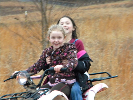 vanesa and mary on 4 wheeler 107