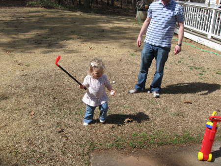 Taylor not quite 2 yrs old but swinging a club