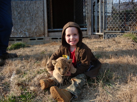 Braden and the lion cub.