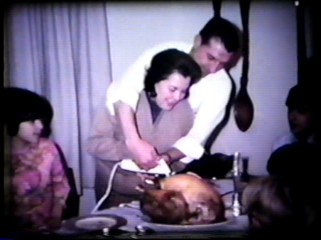 My mom and dad cutting the Christmas turkey