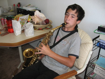 Amado Practices His Alto Sax