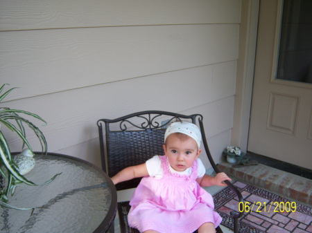 Maci sitting on our back porch.