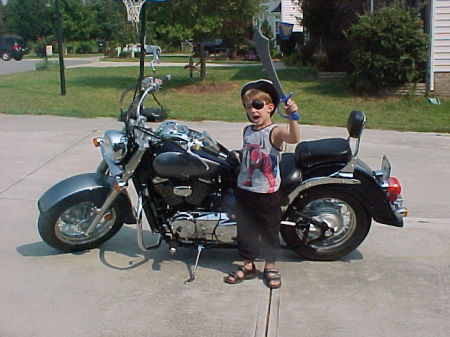 My son playing by my Motorcycle