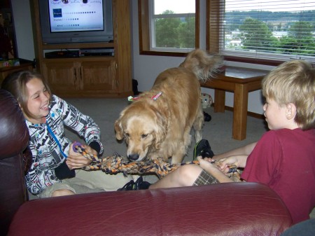 Andrea and Ryker tug of war with Spot 021