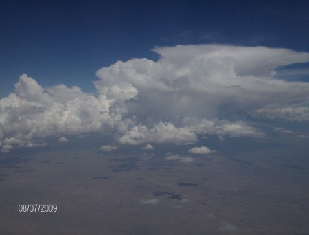 Flying in an airplane.