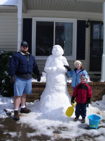 Alyssa, Zebulon and me in front of our house.